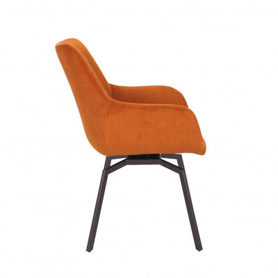 Moderne oranje fluwelen stoel met een comfortabele gewatteerde zitting en stijlvolle zwarte metalen poten, ideaal voor een levendig en trendy interieur.